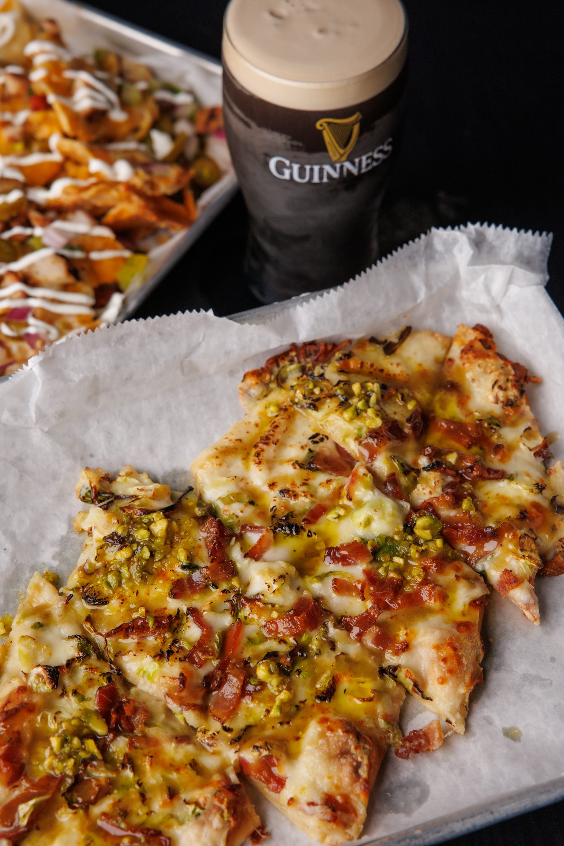 Flatbread, loaded nachos, and Guinness at The Locals Pub