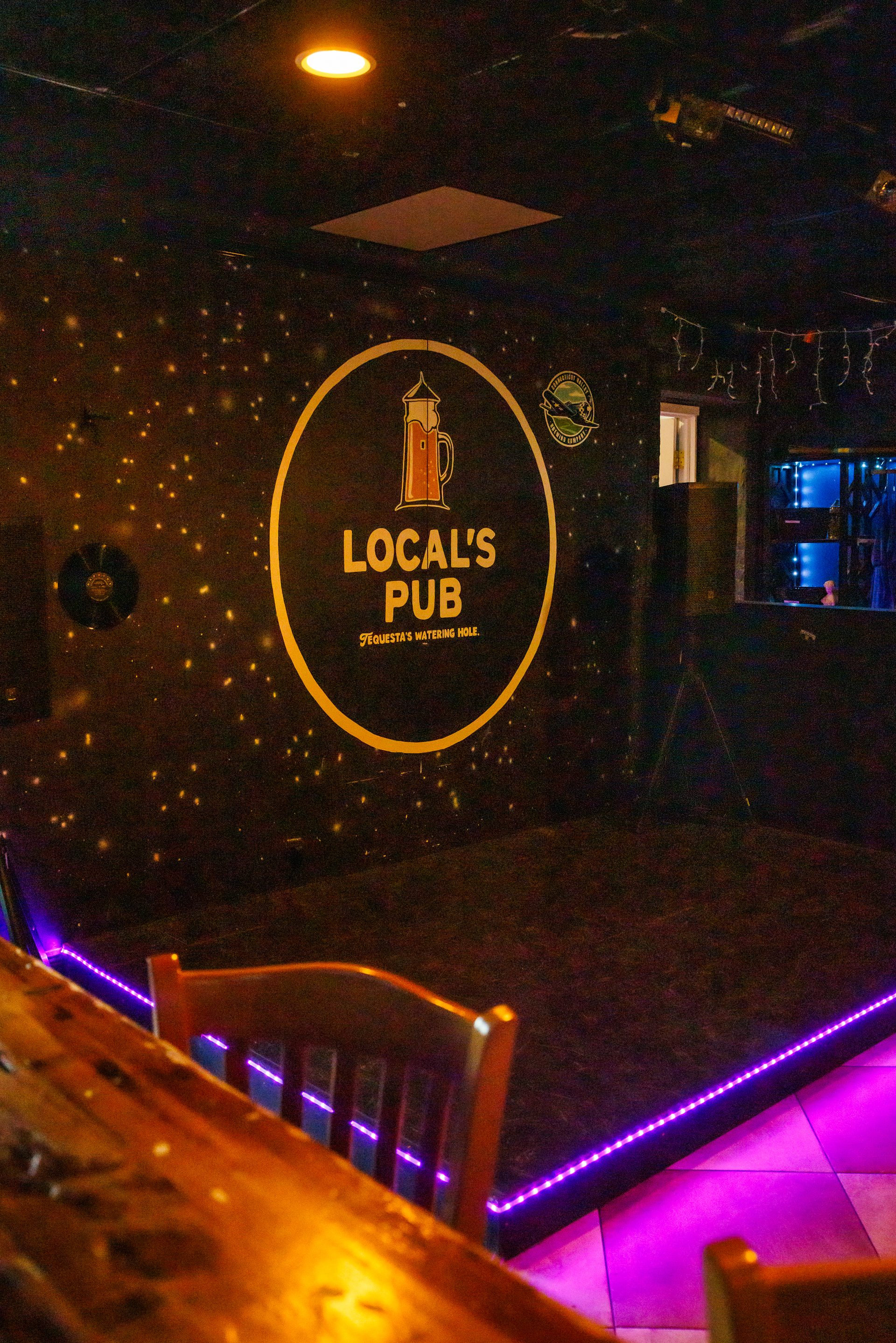The Locals Pub logo wall and stage - Tequesta's Watering Hole