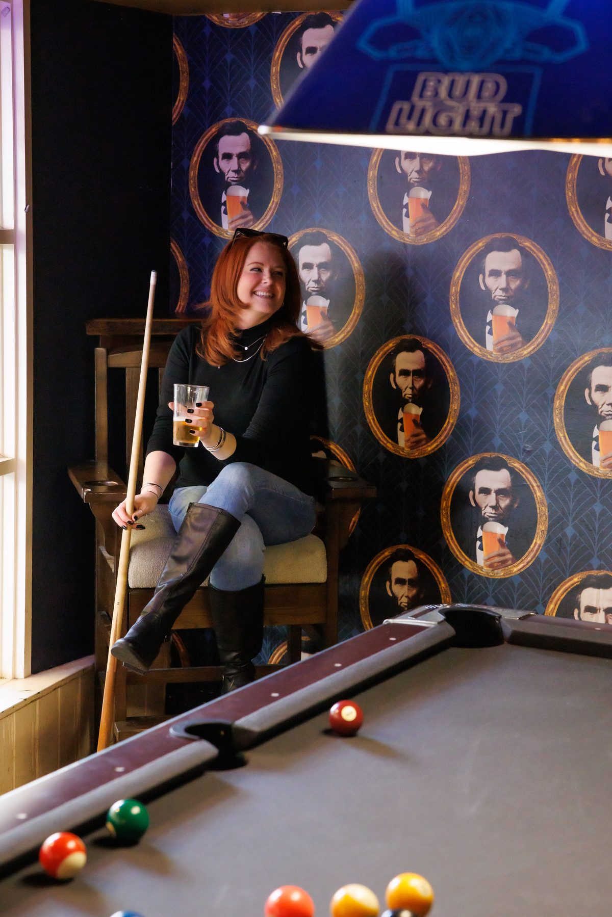 Pool table with iconic Lincoln wallpaper at The Locals Pub
